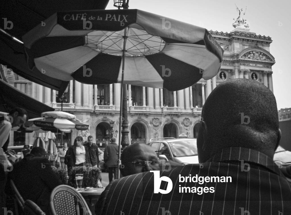 People in the terrace of the Cafe de la Paix in front of the Paris Opera House (Palais Garnier)