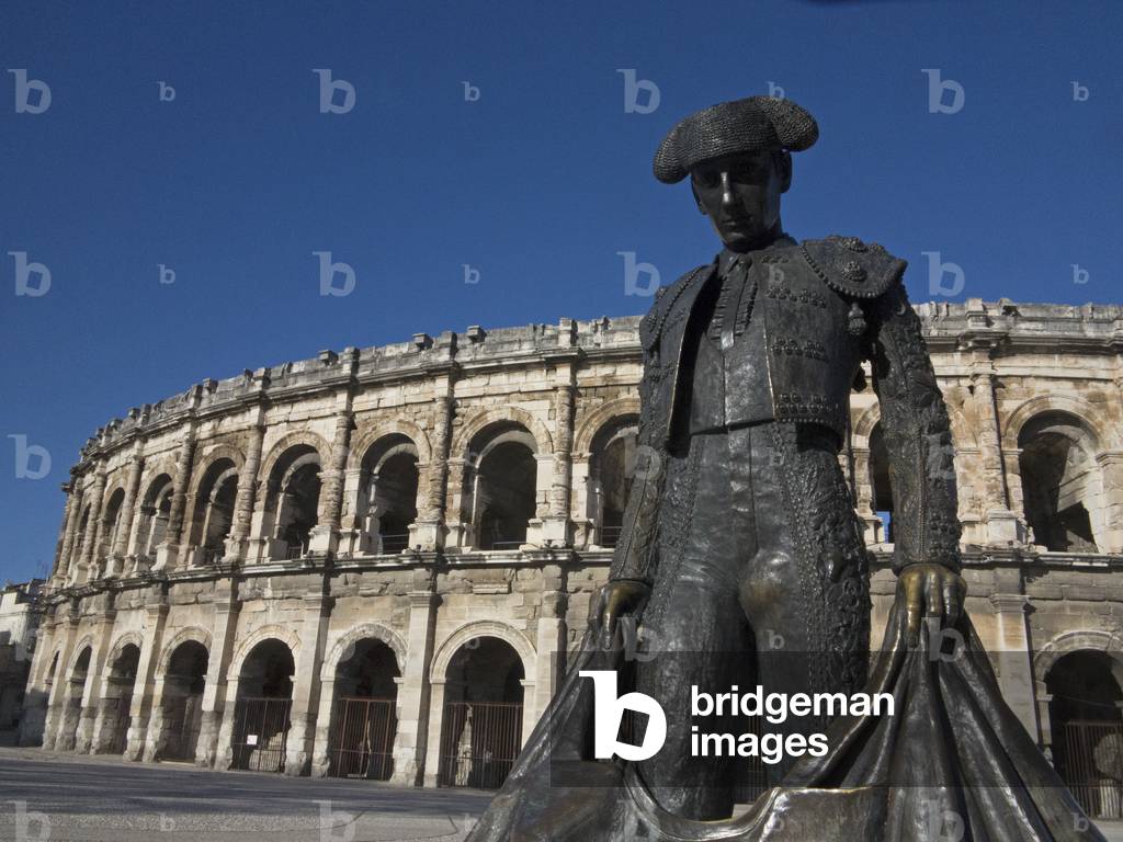 Nimes, France. Monument to Matador by Sara Carone (1994) in front of the Arena