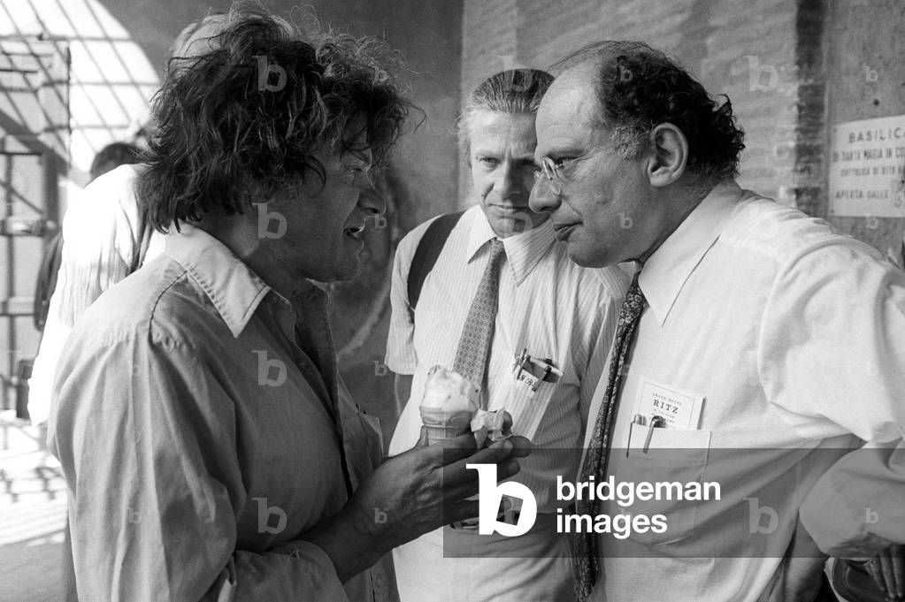 Rome, portico of the Church of Santa Maria in Cosmedin, 1980. Beat Generation writers Gregory Corso, Peter Orlowsky and Allen Ginsberg, in town to attend the Second Festival of Poets/Roma, portico della basilica di Santa Maria in Cosmedin, 1980. Gli scrittori della Beat Generation Gregory Corso, Peter Orlowsky and Allen Ginsberg, in citta per part of the second Festival dei poeti -