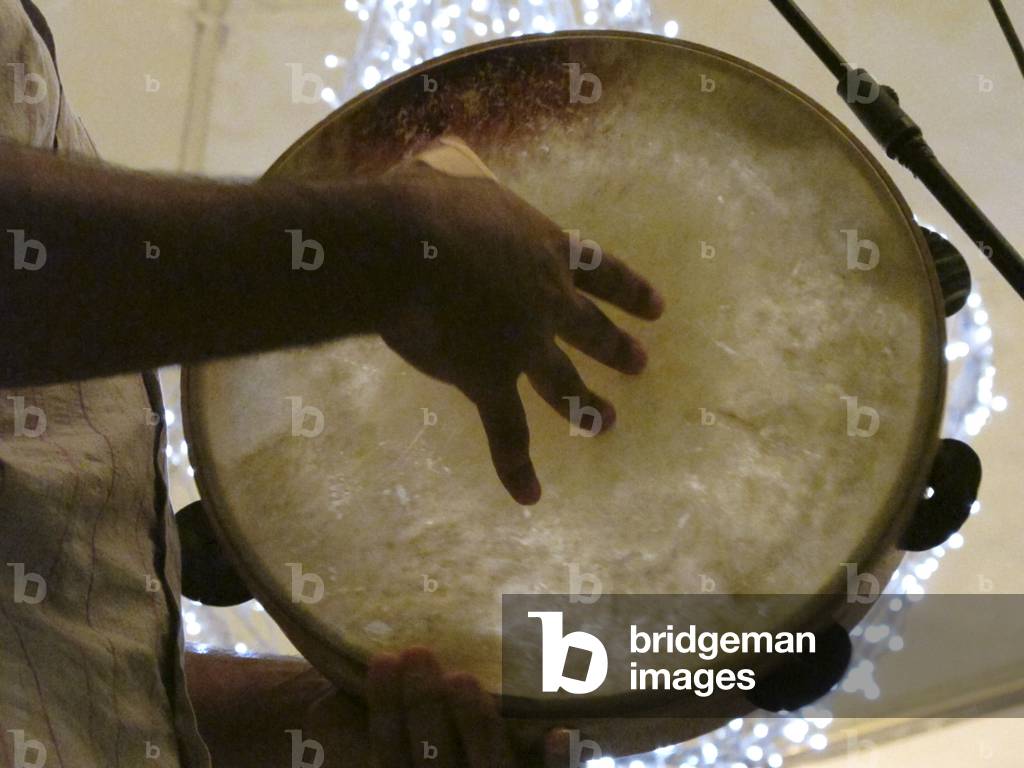 Galatina, Italy. Musician playing Pizzica with tambourine. Pizzica is a frenetic traditional dance born in this town to heal the 