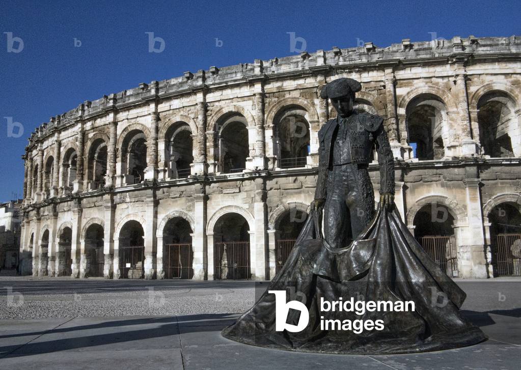 Nimes, France. Monument to Matador by Sara Carone (1994) in front of the Arena