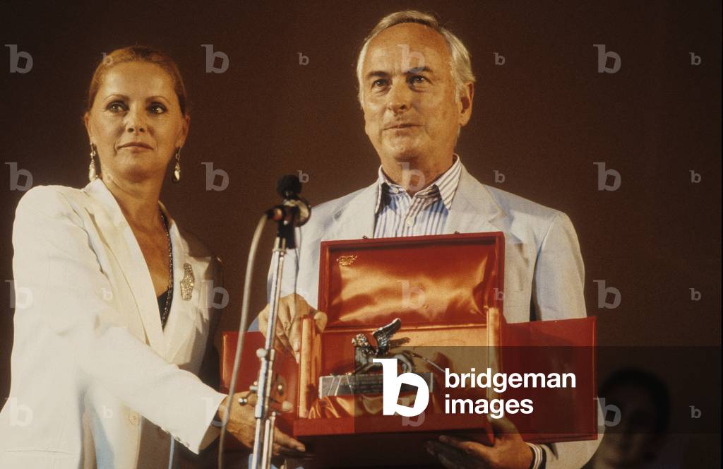 Venice Lido, Venice Film Festival 1987. British director James Ivory receives Silver Lion Award for the movie “” Maurice” from actress Virna Lisi/Lido di Venezia, Venice Film Festival 1987. James Ivory riceve il Leone d'argento for the film “” Maurice” by Virna Lisi -