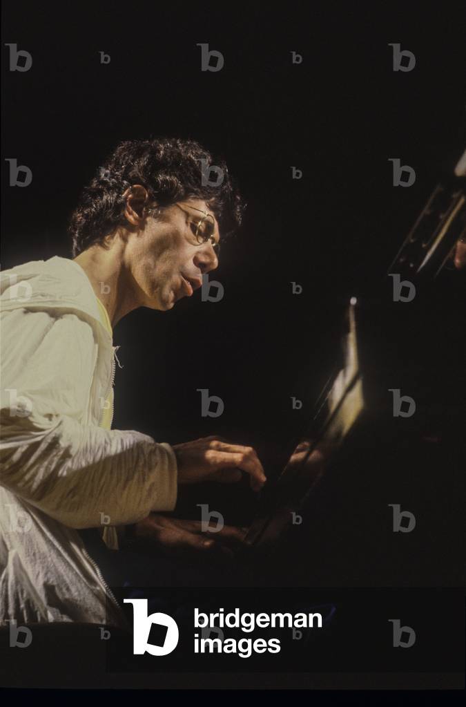 American jazz-fusion pianist, keyboardist, and composer Chick Corea performing (about 1985) (photo)
