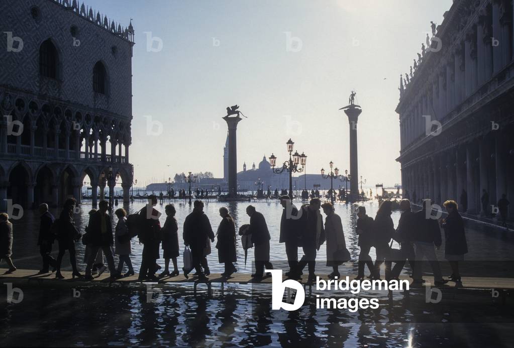 Venice, 1998. High Tide in St. Mark's Square. People walking on the gangways