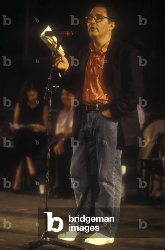 Ancient Ostia (Rome), 1984. Italian poet Renzo Paris during a reading (photo)
