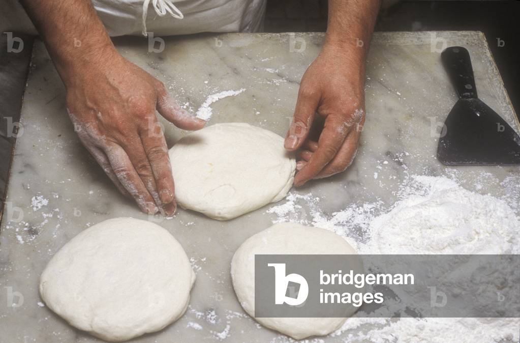 Naples, Italy. Preparation of Pizza Margherita at Brandi pizza restaurant, where in 1889 it was invented in honour of Queen Margaret (Margherita) of Savoy. First step: prepare the crust