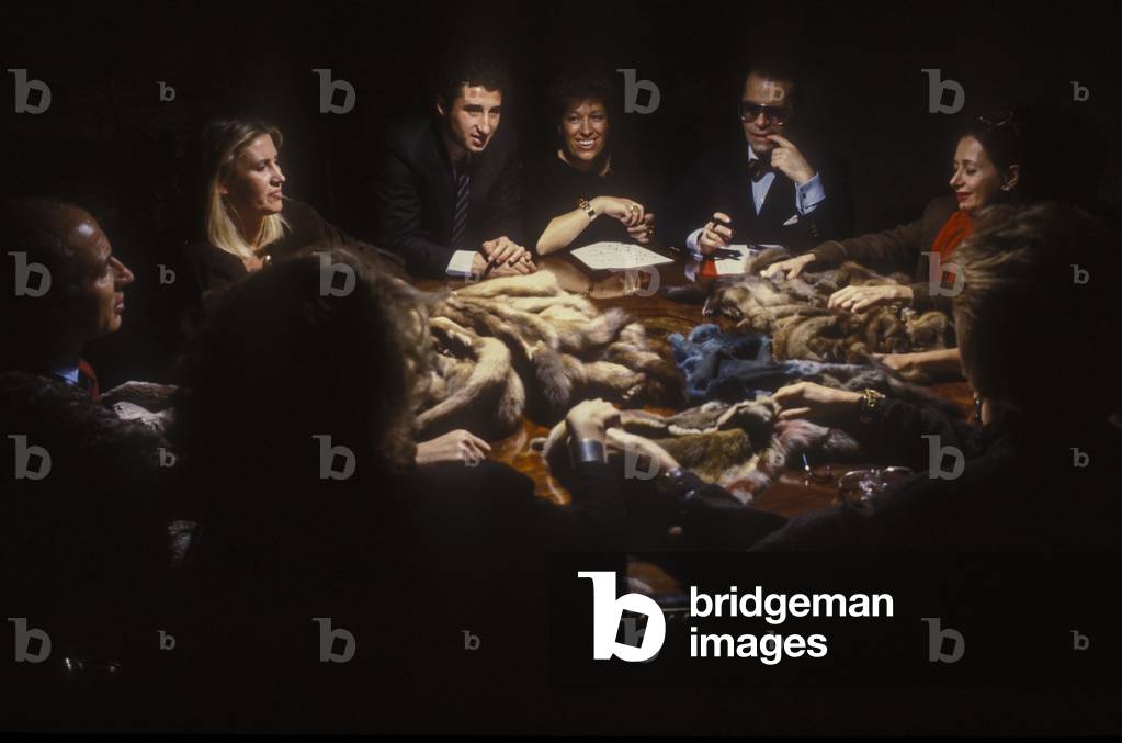 Rome, 1986. Fashion designer Karl Lagerfeld (fifth from the left, sitting between Carla and Paola Fendi) at work with sisters Fendi and their staff to design the new collection of Fendi furs (photo)