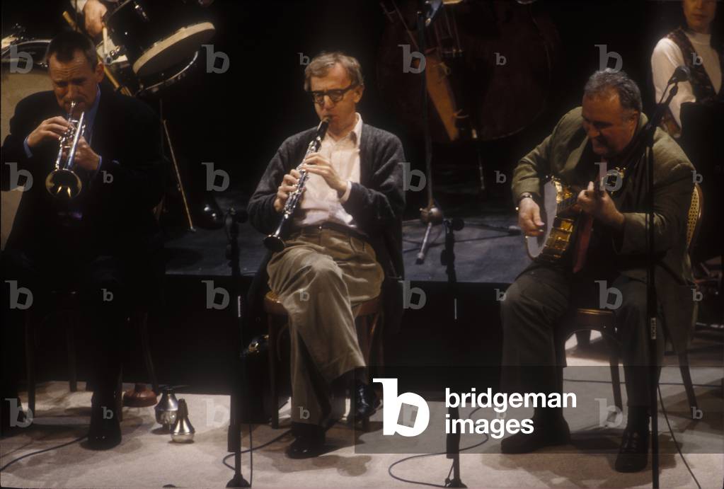 Venice, 1996. Actor-director Woody Allen performs on clarinet with his New Orleans Jazz Band at Goldoni Theater (photo)