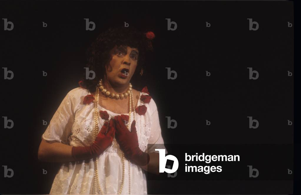 Opera singer and actor Michel Aspinall en travesti during a performance, (1981) (photo)
