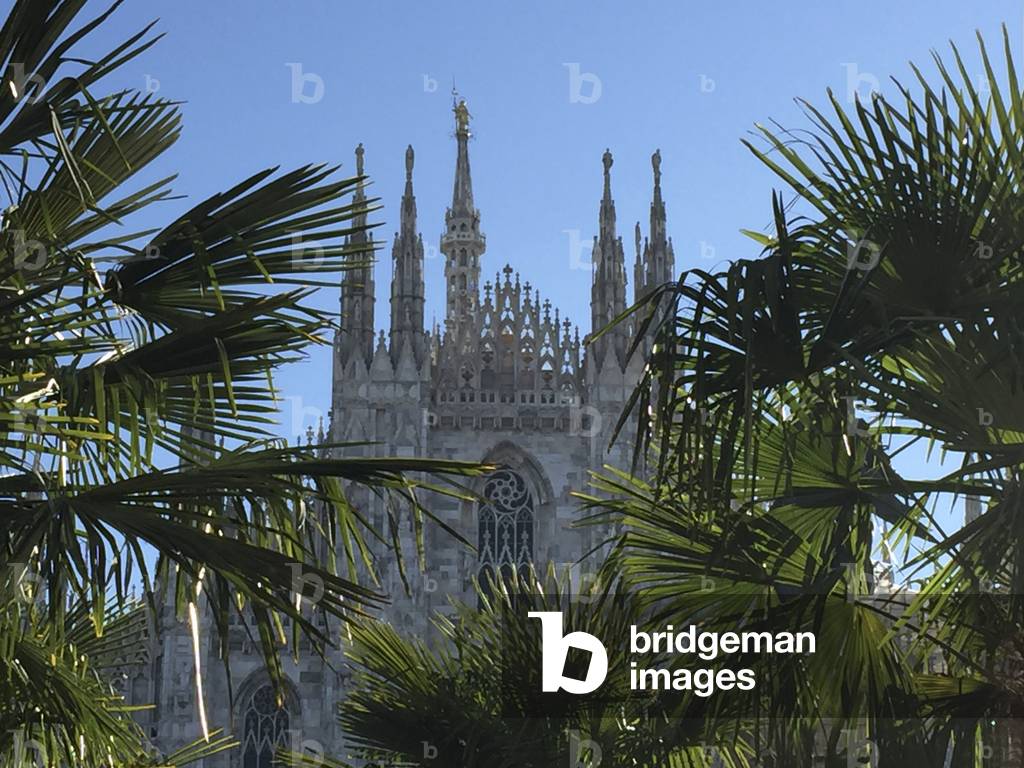 Milan, January 2017. Starbucks-sponsored palm trees in Piazza del Duomo