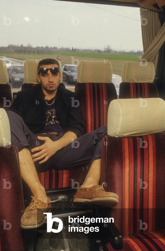 Italian National Singers' Football Team, 1987. Singer Eros Ramazzotti on the team bus (photo)