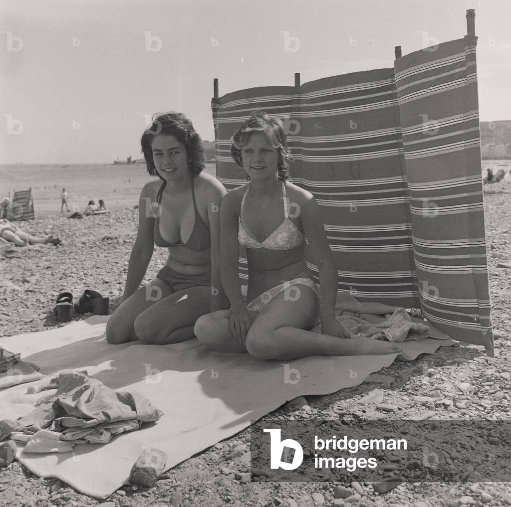 Holidaymakers on Douglas beach, Isle of Man, August 1974 (b/w photo)