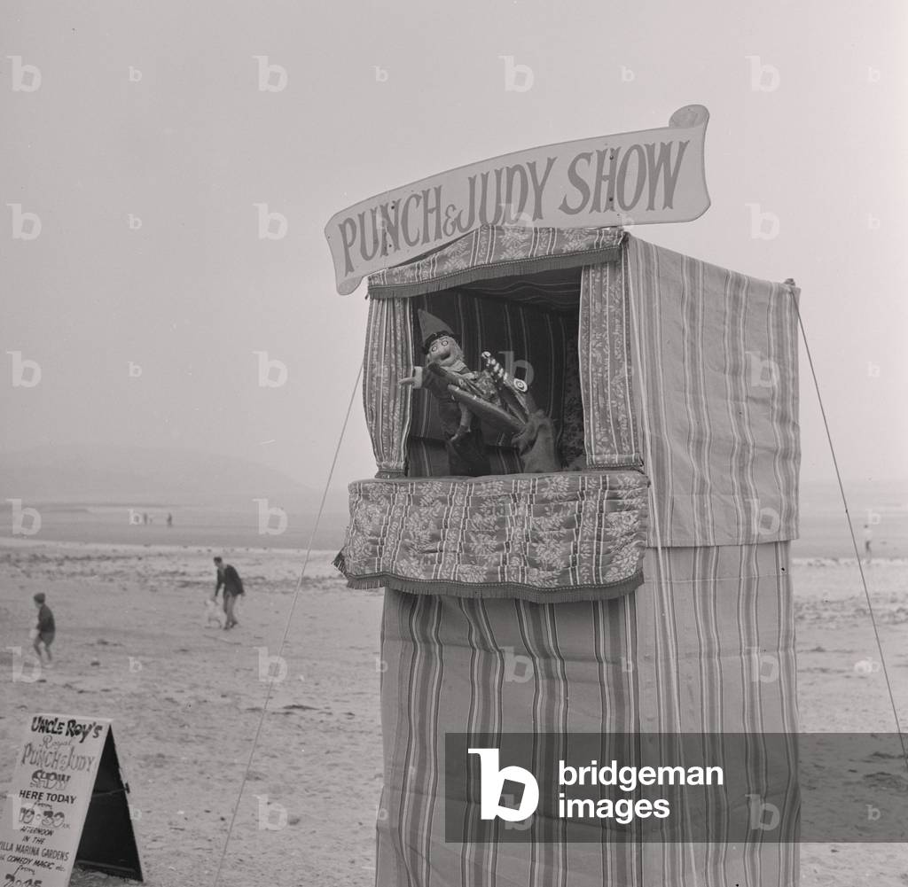 Punch and Judy on Douglas beach, July 1965 (b/w photo)
