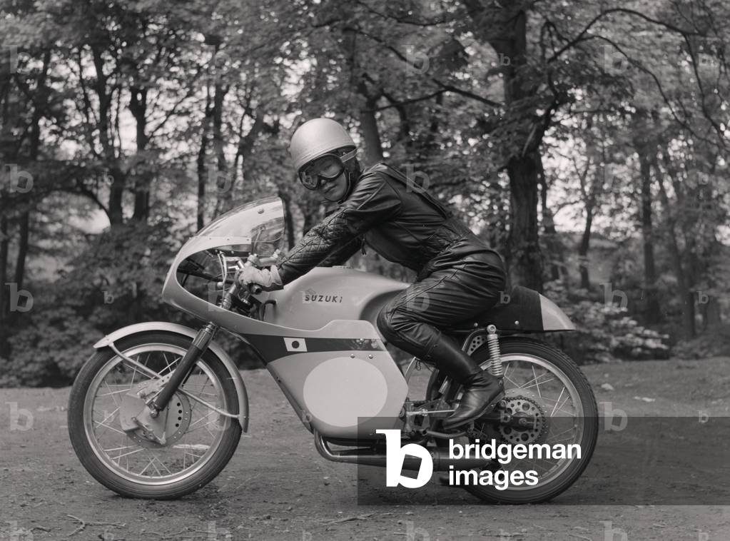 Japanese rider on motorcycle, possibly from Suzuki, May 1960 (b/w photo)