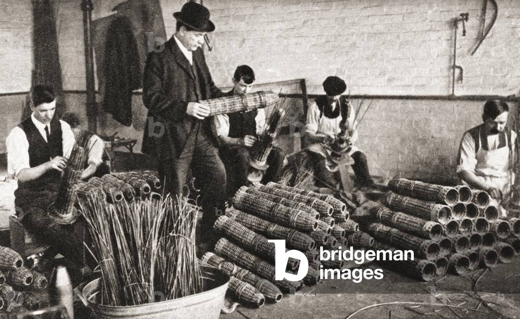 A Nottingham factory during World War One which made shell baskets in which projectiles were packed for safe transport, from The Pageant of the Century, pub.1934