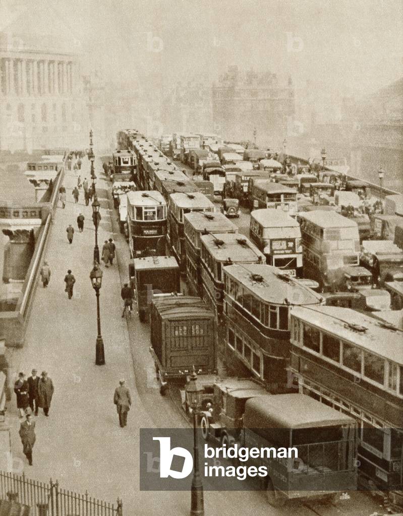 Traffic jam on Blackfriars Bridge, London, England in the 1930's.  From The Story of 25 Eventful Years in Pictures published 1935