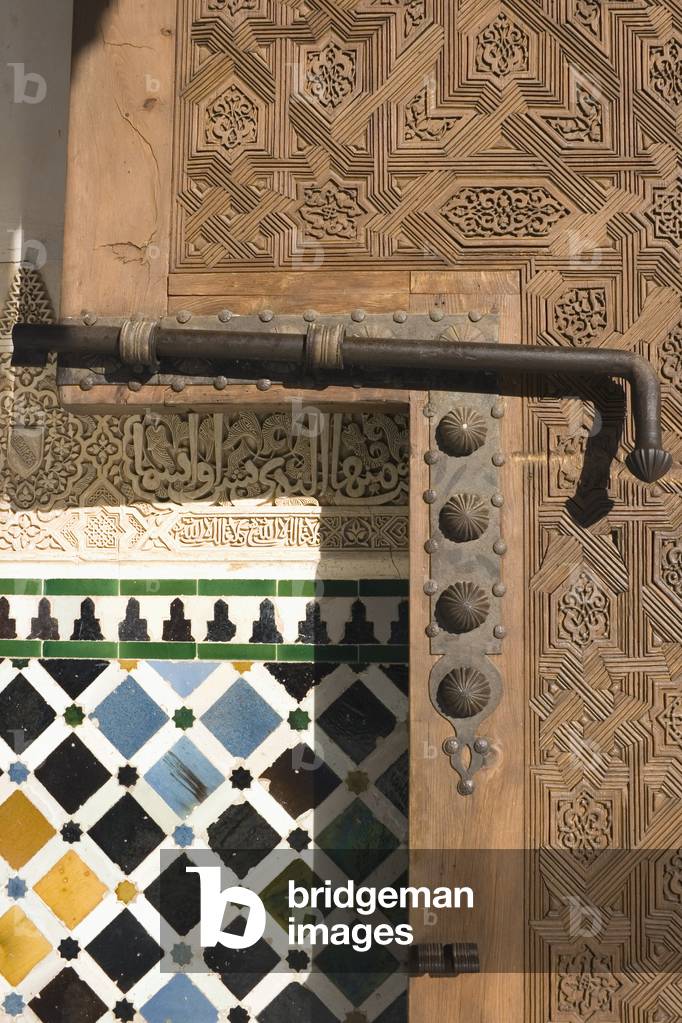 Detail of carved wooden door, bolt and wall, Alhambra Palace, Granada, Andalucia, Spain (photo)
