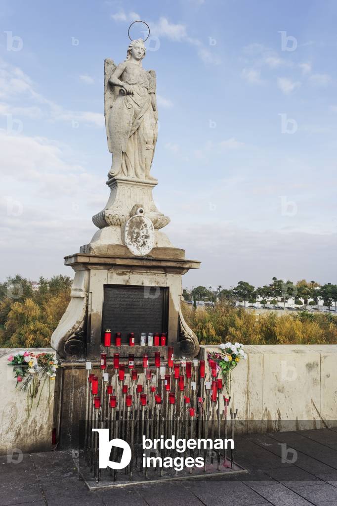 Statue of San Rafael patron saint on Roman bridge, Cordoba, Spain (photo)