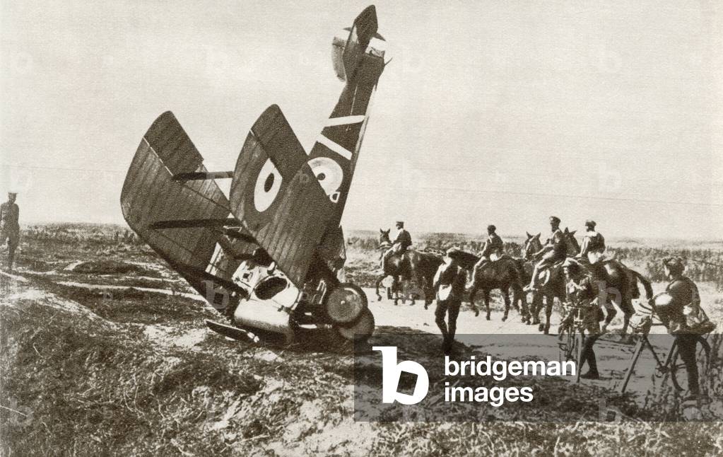 A crashed aeroplane near Cherisy, France during World War One.  From The Story of 25 Eventful Years in Pictures published 1935