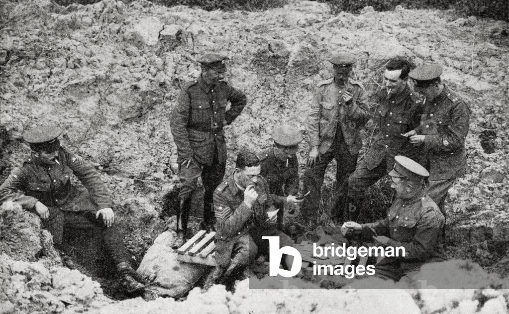 The Opportunists. Warrant Officers and N.C.O.'s playing cards in a shell hole in 1917.
