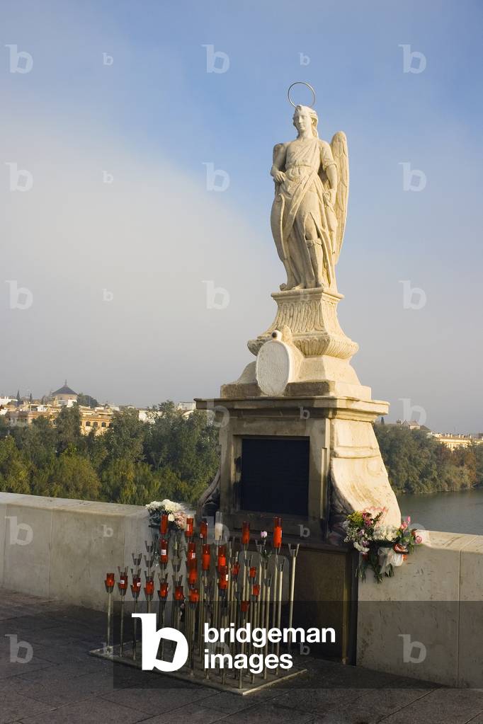 Cordoba, Spain.  Monument to San Rafael on the Roman Bridge. (photo)