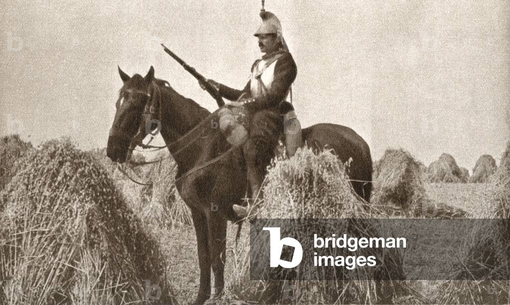 A French cuirassier on sentry duty at the start of WWI in 1914, Soon after the use of both helmet and breast plate was abolished, from The Pageant of the Century, pub.1934