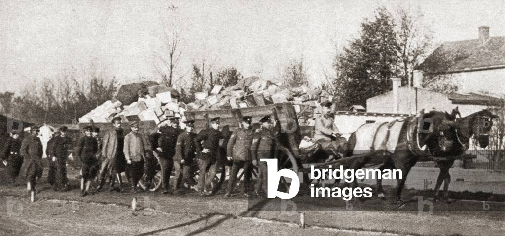 Food parcels courtesy of the Red Cross arriving at German prison camps during World War One, from The Pageant of the Century, pub.1934