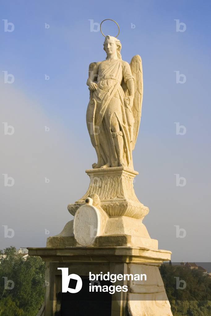 Cordoba, Spain.  Monument to San Rafael on the Roman Bridge. (photo)