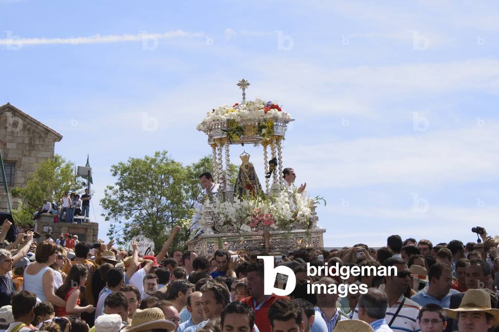 Andujar Jaen Province Spain   Annual Romeria of La Virgen de la Cabeza  Throne with statue of La Virgen and two priests being carried amongst multitude of believers (photo)