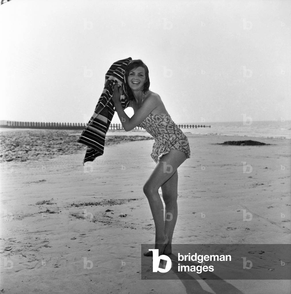 Beach Glamour: Having holiday fun in the sun at Minnis Bay near Margate, Kent. are girl with dark hair (A red head) Beverley Bennett age 18 and Blonde Ingrid Young age 16 both girls are actresses at the Adia Foster School. June 1960
