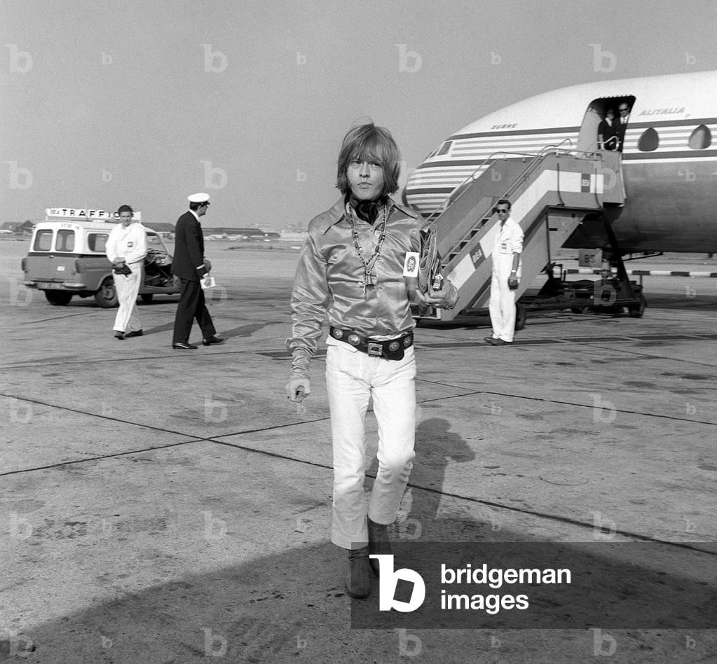 Brian Jones of the Rolling Stones pop group arrives at London's Heathrow Airport from Rome, 1967 (b/w photo)