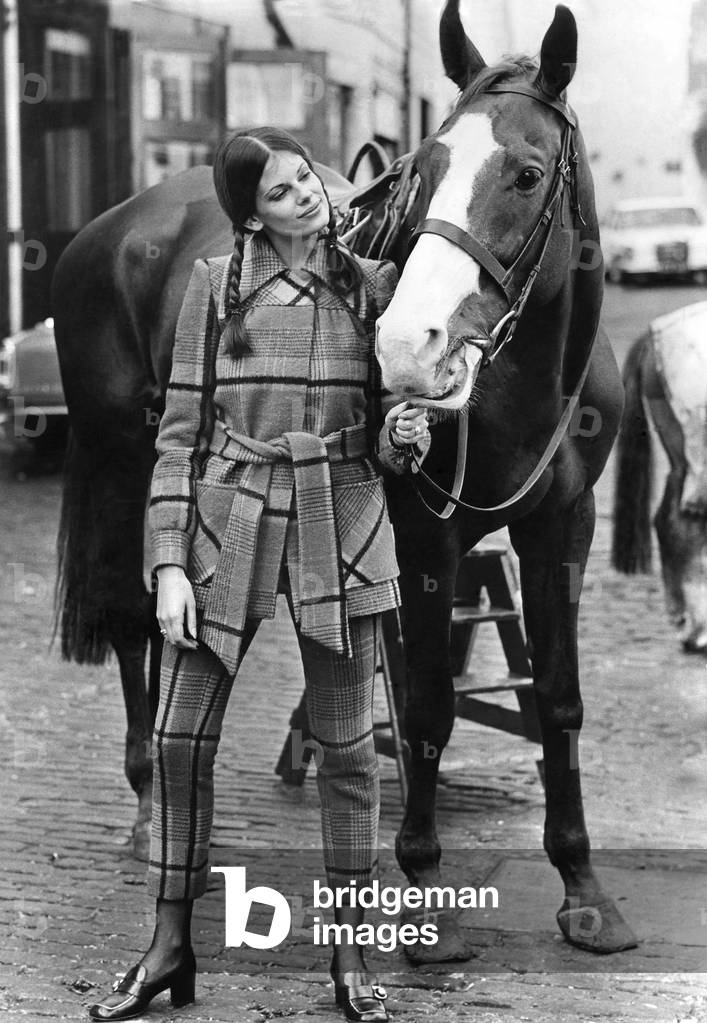 Right: yellow and black cheeked jacket has back tucks and a set-in belt with loose front tie ends. It teams with the new cropped-off trousers that leave a show of ankle. Both jacket and pedal pushers by Sheration in sizes 10-14. jacket costs £13.75; the trousers £5. October 1971