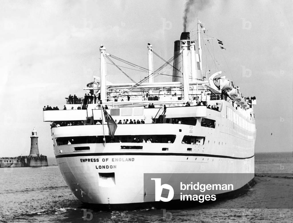 The passenger liner Empress of England, under her own steam, passes through the Tyne piers and heads out into the open sea in, March, 1957 (b/w photo)