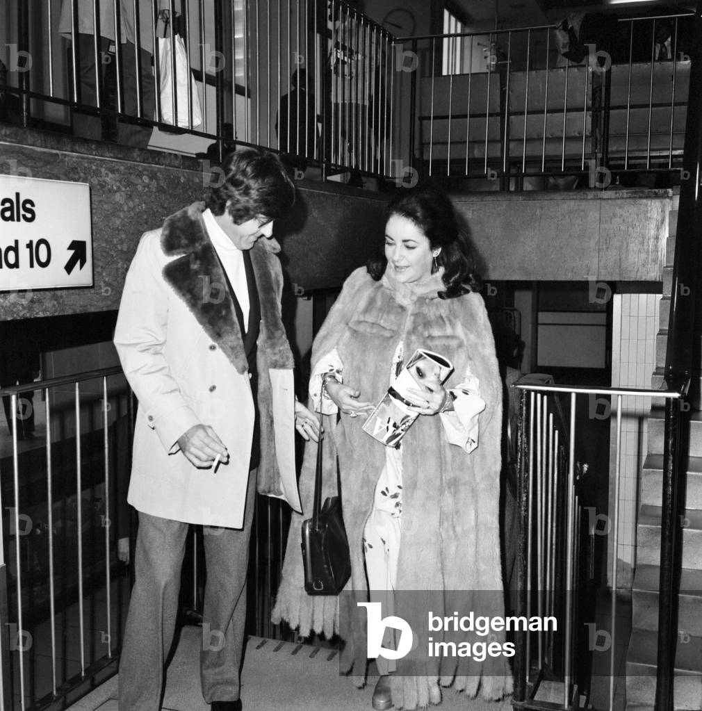 Elizabeth Taylor with Henry Wynberg seen here arriving at Heathrow Airport, February 1975