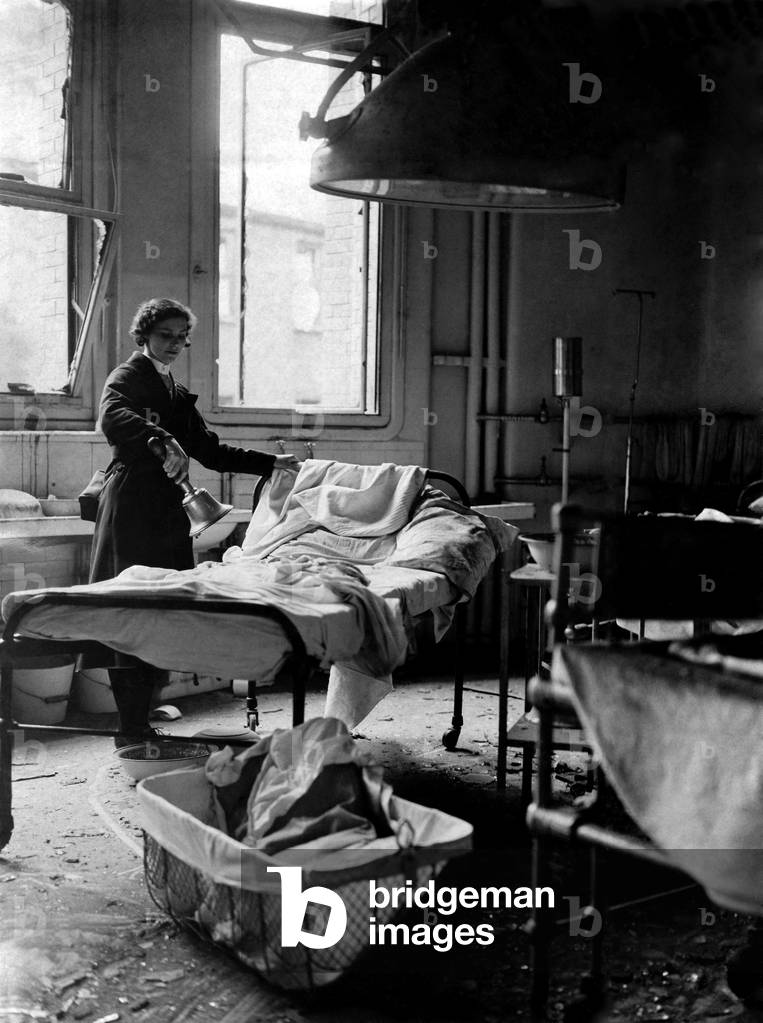 This is the room in which Mrs.Hanley's twins were born. . . .The crib is full of debris when the London Maternity Hospital was bombed, the babies were under their mother's bed. 10th September 1940 P012276