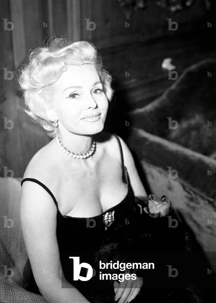 Zsa Zsa Gabor at a reception at The Dorchester Hotel, London.
25th August 1957.