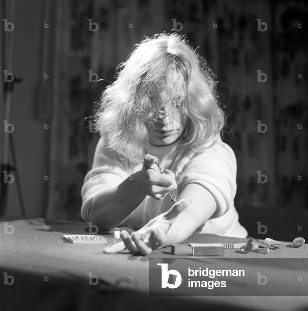 Model shot: Drug addict seen here taking drugs. 1960