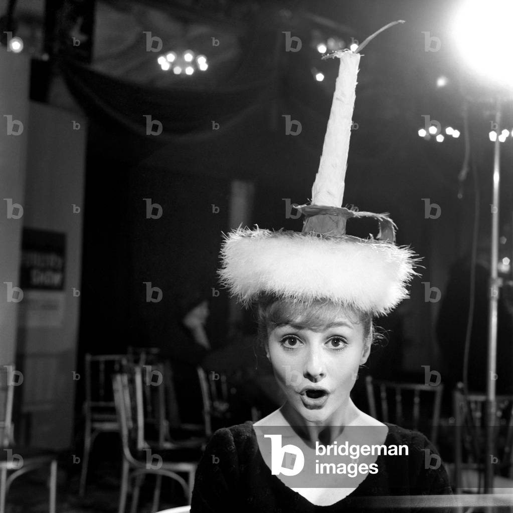 At the Cafe Royal, Regent St. the 5th Annual Festival of Poultry Feather Hats was held - there were two classes Fashion Hats and Zany Hats, both classes were judged Otto Lucas the well known milliner. All the hats were entered by amateurs in a nation-wide competition which will be featured at the International Poultry Show (Olympia London). Elizabeth Tree in 