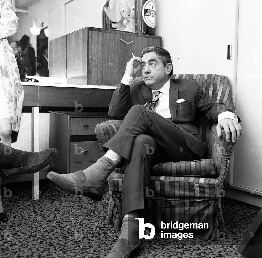Pic shows comedian Tony Hancock gets into car outside ABC Theatre, Blackpool, for his drive to London to see sick wife after the televised Blackpool show. 13th July 1966 (b/w photo)