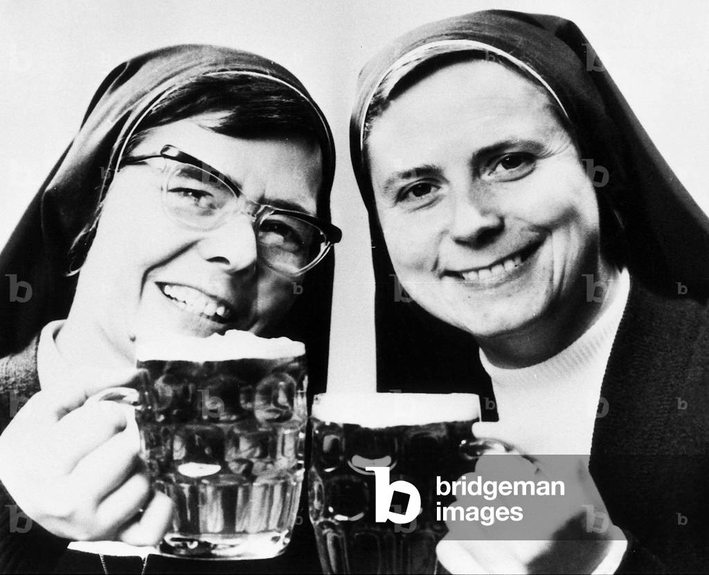 Nuns Sisters Elizabeth and Joan with pints of beer 1976 (b/w photo)