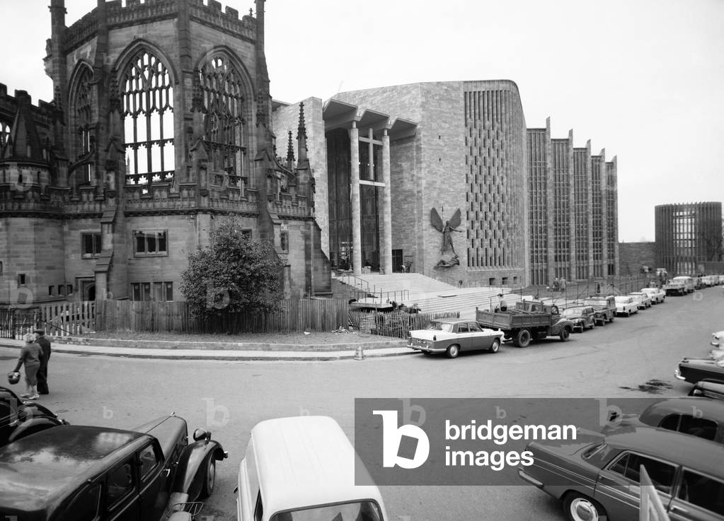 Craftsmen put the finishing touches to the new Coventry Cathedral which stands alongside the old Cathedral which was destroyed in the war, c. March 1962 (b/w photo)