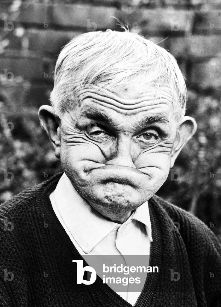 One of the faces of champion gurner Dai Llewellyn, of Mountain Ash, now aged 82 but gurning as well as ever 
August 1978