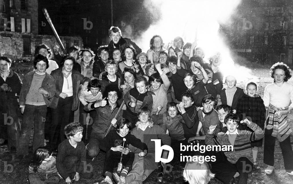 A group of happy children on November 5, Dale Street, Glasgow, Scotland, 1978 (b/w photo)