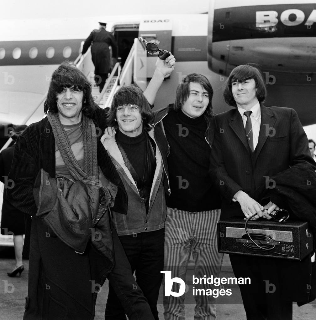 American group The Lovin' Spoonful arrive at London airport from New York. They are (left to right) Zal Yanovsky, John Sebastian, Joe Butler and Steve Boone. 13th April 1966 (b/w photo)