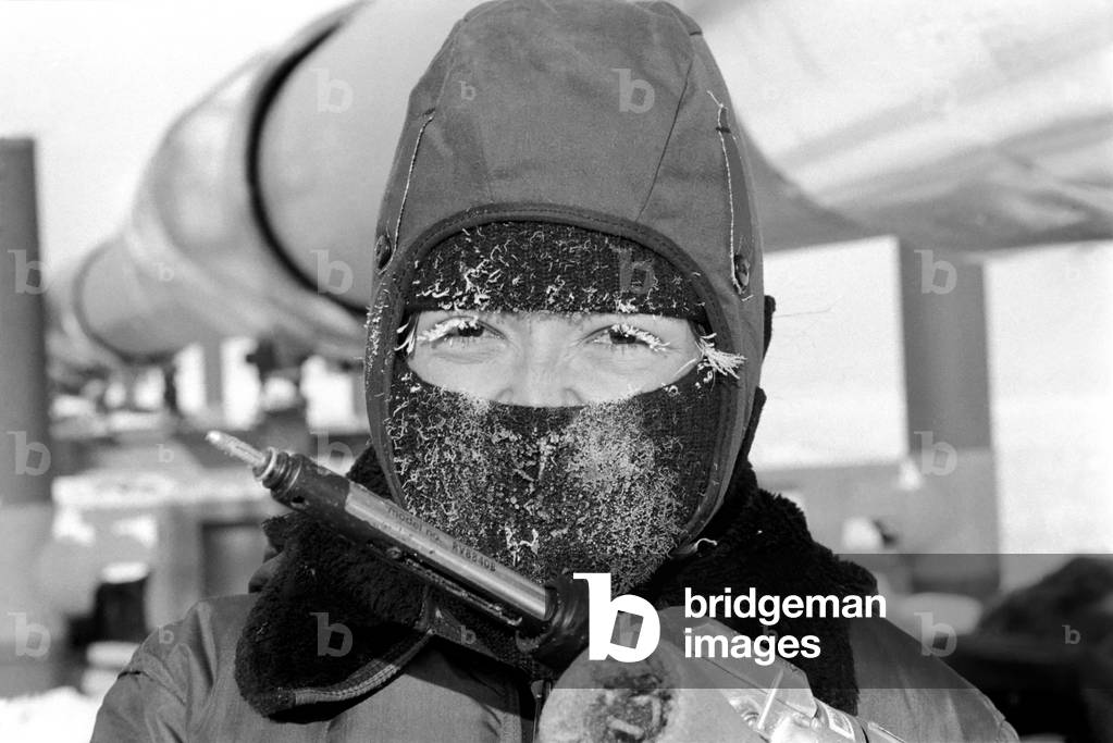Prudhoe Bay Alaska. Workmen working on the pipeline (insulating it) at Prudhoe Bay, April 1977 (b/w photo)
