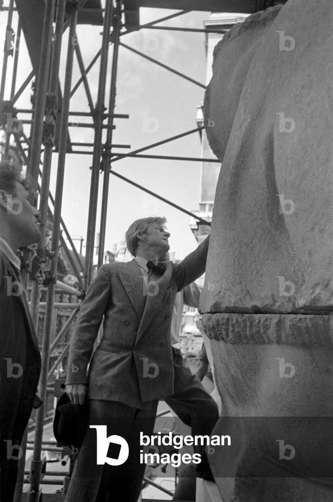 Sculptor Chas Wheeler overseeing the installation of his work 