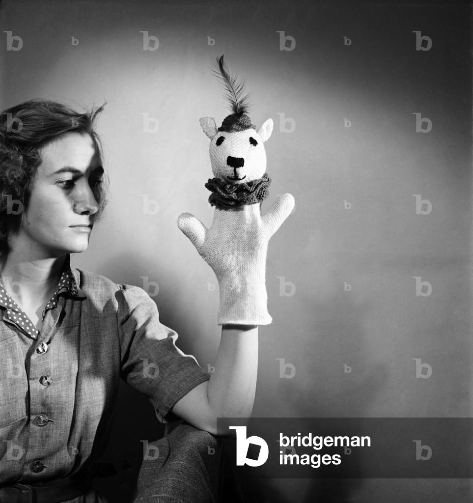 K.41-Knitting woman modelling knitted hand puppet. February 1952 C6278