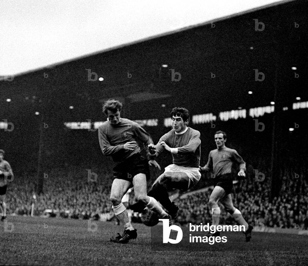 Manchester United's left back Tony Dunne comes flying in to halt an Ipswich player during their match at Old TraffordNovember 1968 (photo)