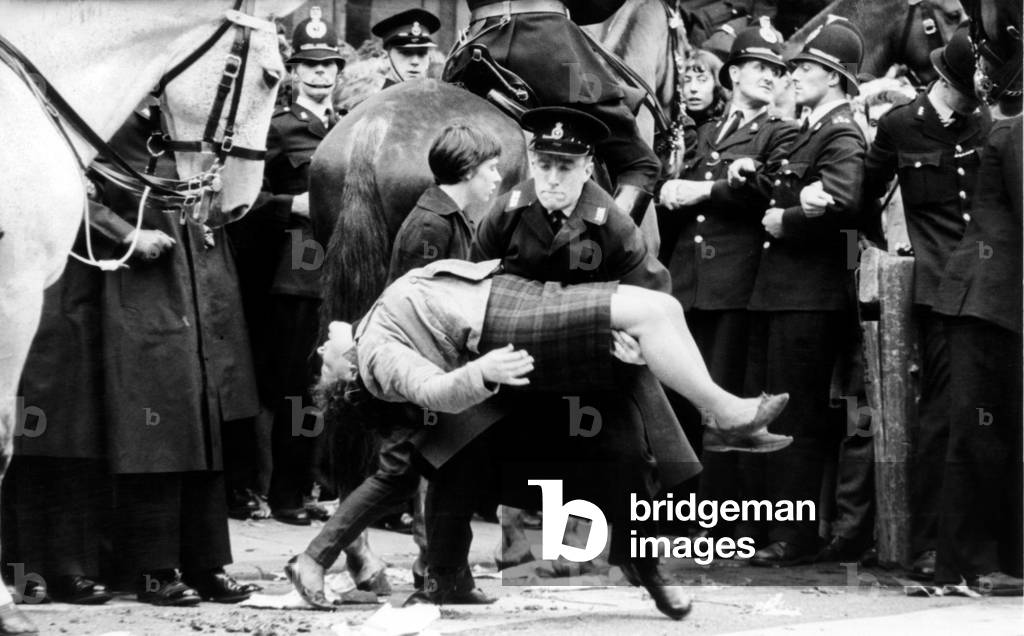 The Beatles in Liverpool, Friday 10th July 1964. Back home for evening premiere of 'A Hard Day's Night' at the Odeon Cinema. Pictured: girl fan faints outside Town Hall.