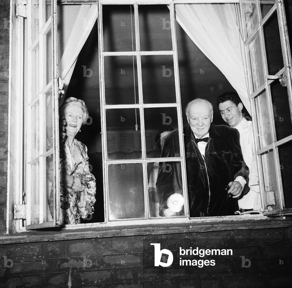 Winston Churchill acknowleding the crowd below his window in London, 1963 (b/w photo)